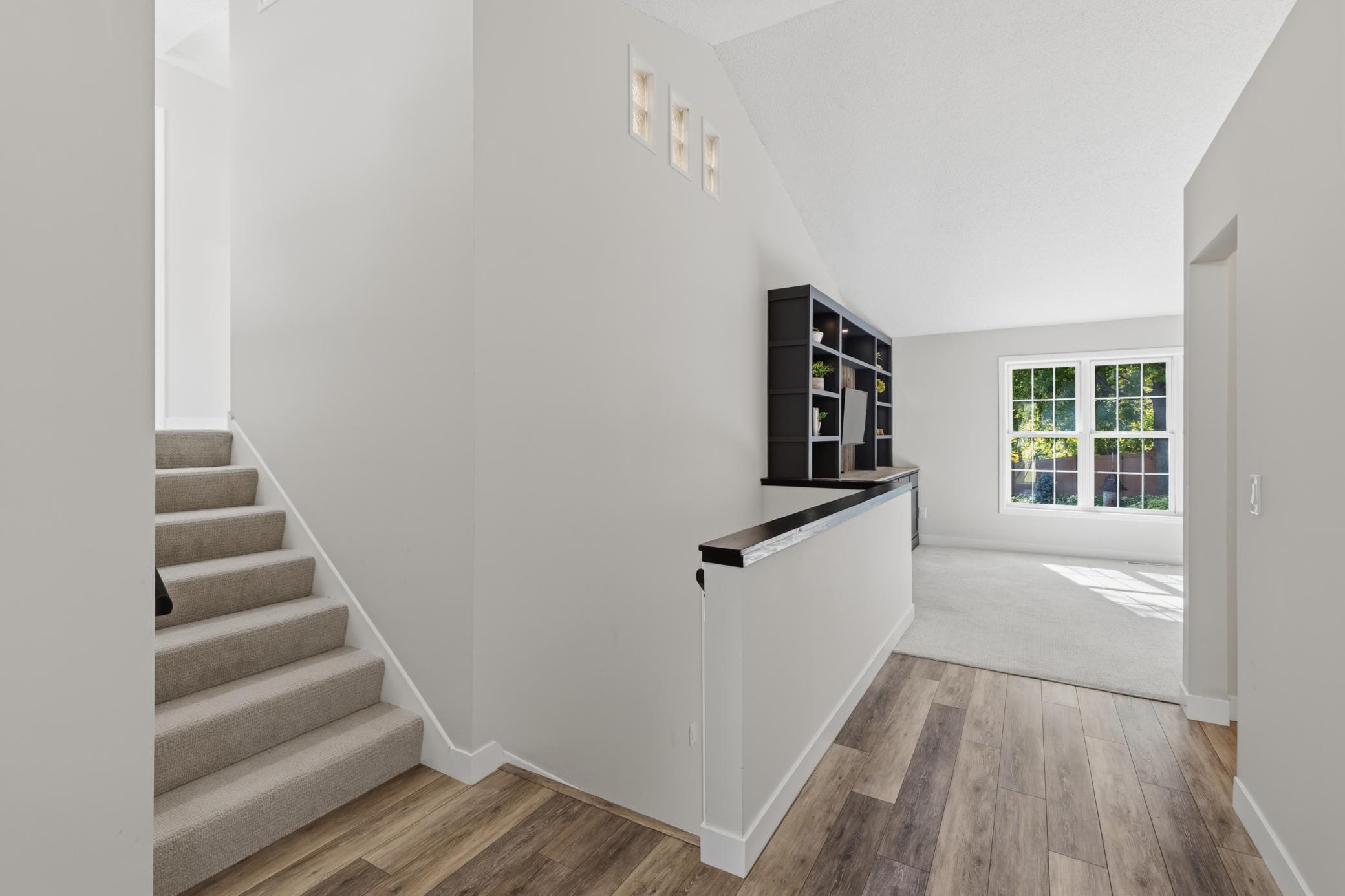 Onto the Lower Level which offers a Family Room, 1 bedroom, 1 bathroom, laundry room and Screen-In Porch