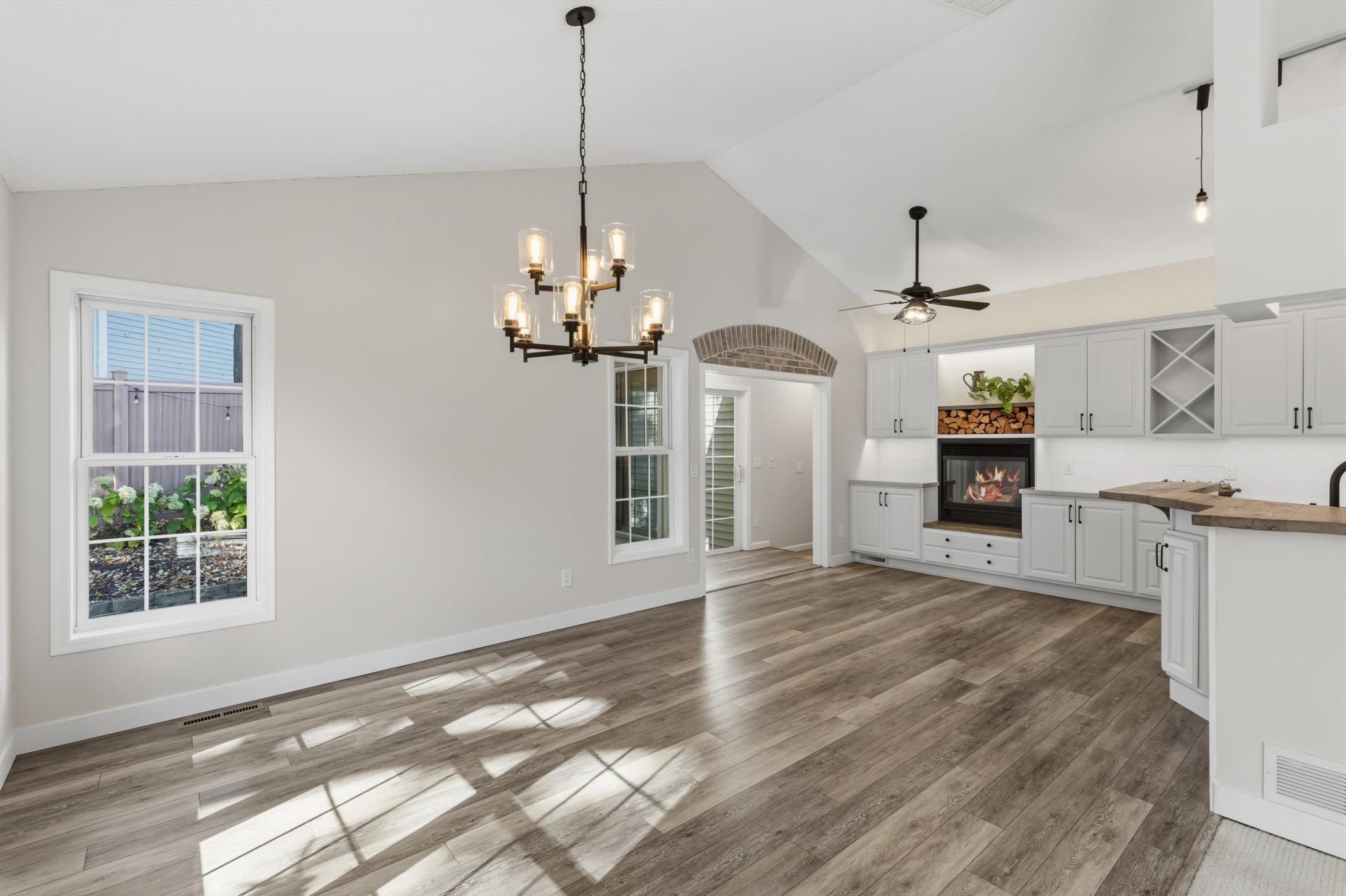 Abundance of windows, vaulted ceilings and luxury vinyl plank flooring