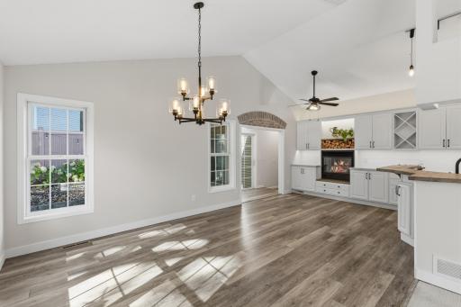 Abundance of windows, vaulted ceilings and luxury vinyl plank flooring