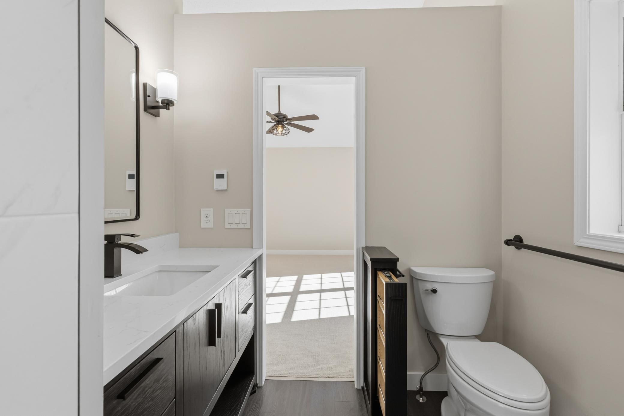 Unique built-in pull-out storage in 1/2 wall. Luxury vinyl plank flooring with radiant in-floor heating