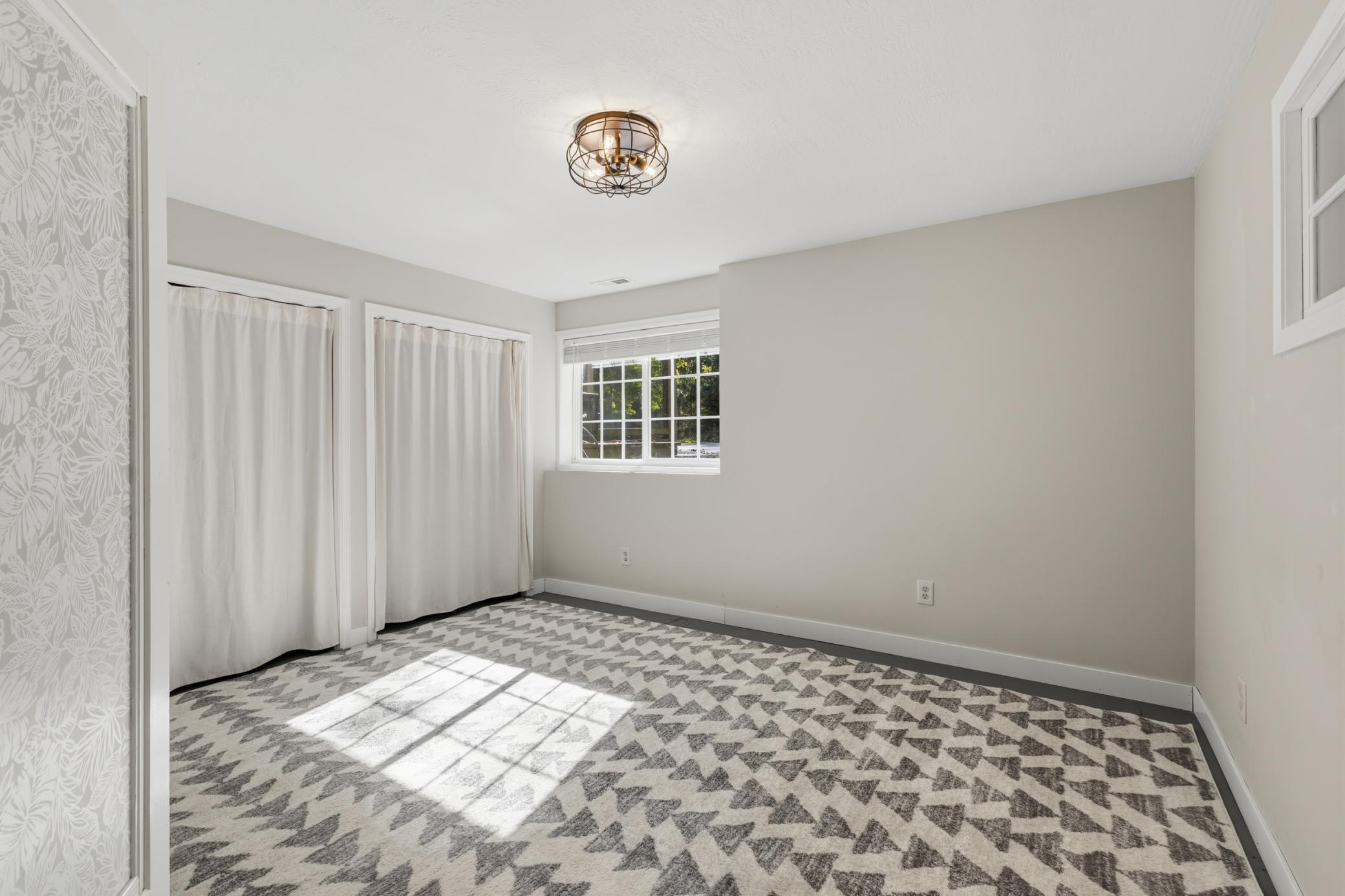 Bedroom 5 features full glass French doors
