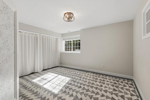 Bedroom 5 features full glass French doors