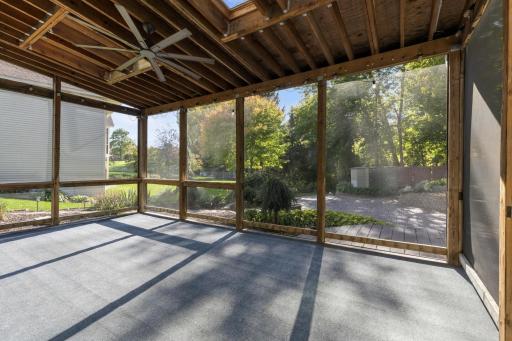 Screened-In Porch features skylights with fan, generously sized and access to the paver patio and backyard