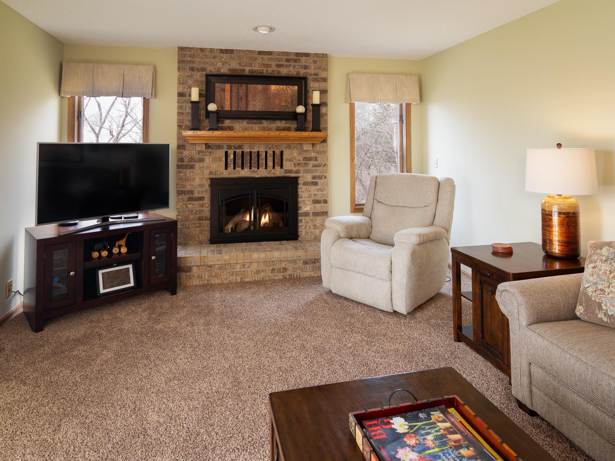 The main level living space features a wood burning fireplace. 1 of 3 at the property