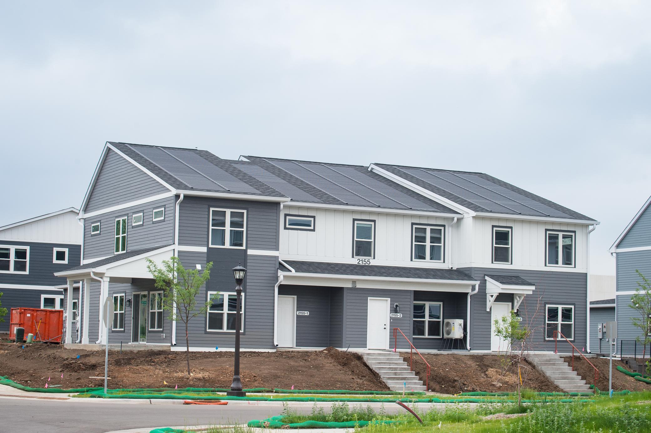 Unit 1 is on the left side - note the solar shingles on the roof.