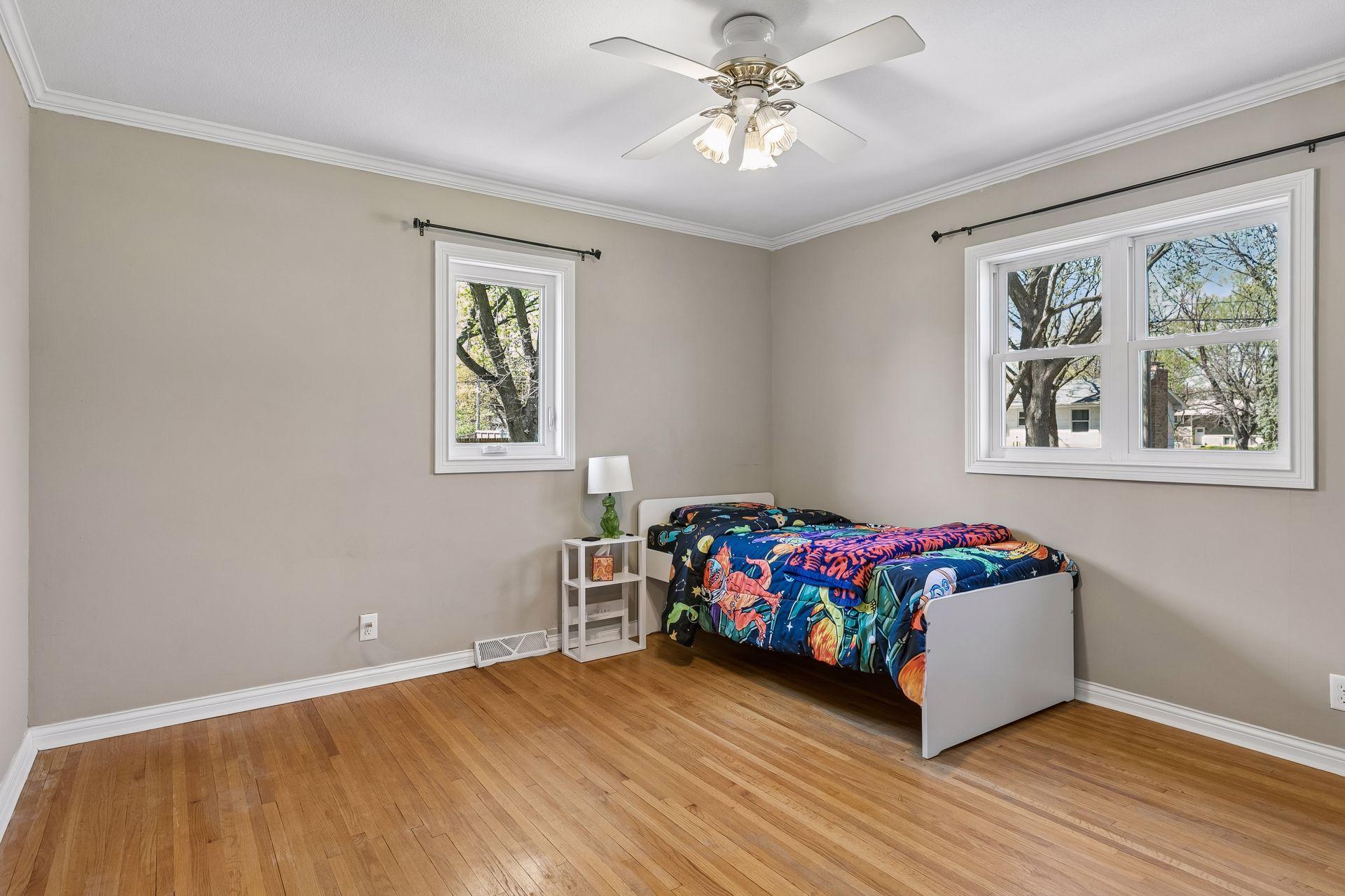 One of three bedrooms on second level with hardwood floors.