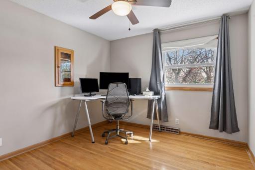 One of three bedrooms on second level with hardwood floors.