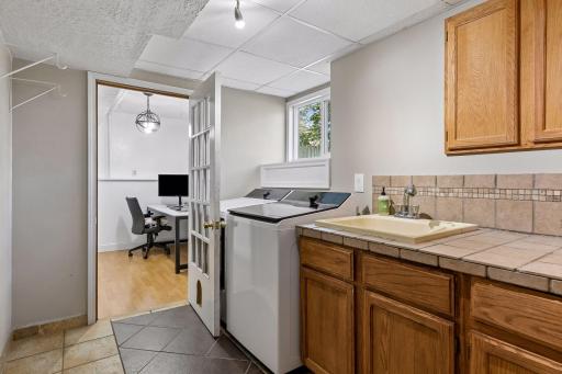 Laundry/mudroom with brand new LG washer and dryer.