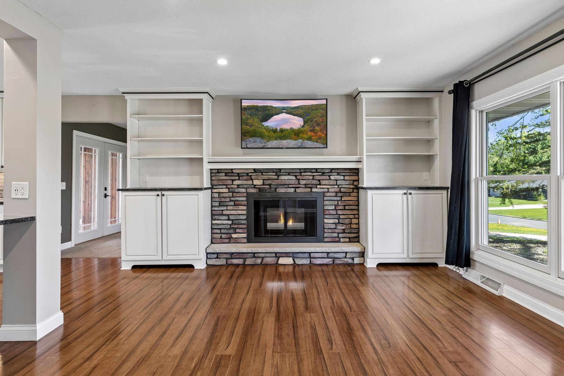 Built-in bookcases flank the fireplace.