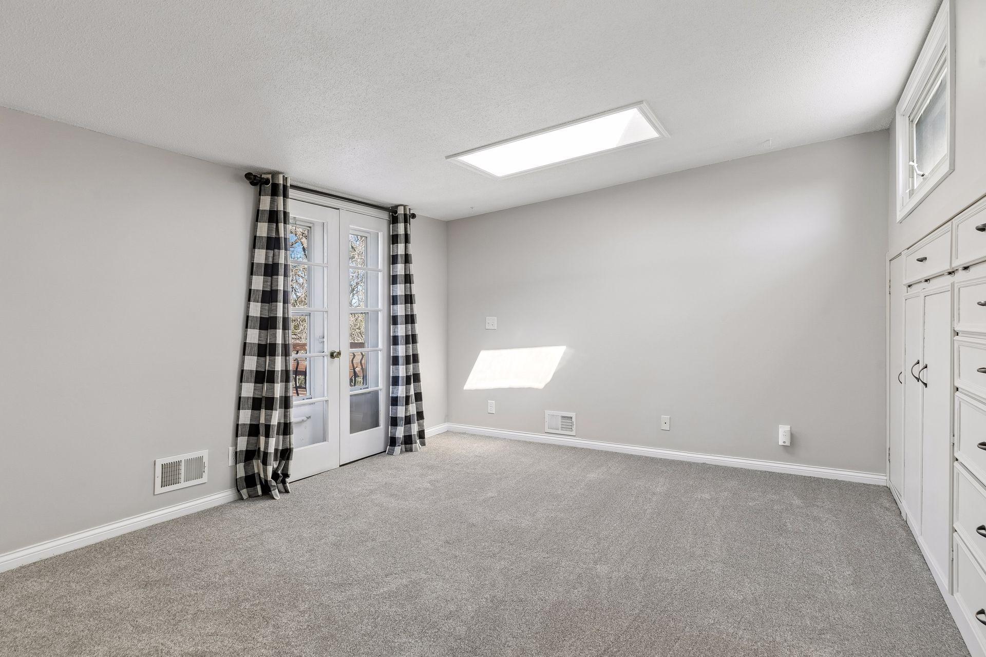 The floor plan provides 3 bedrooms on one level with a private owners suite on its own upper level. The space features a balcony, vaulted ceilings with skylight and a wall of built-ins.