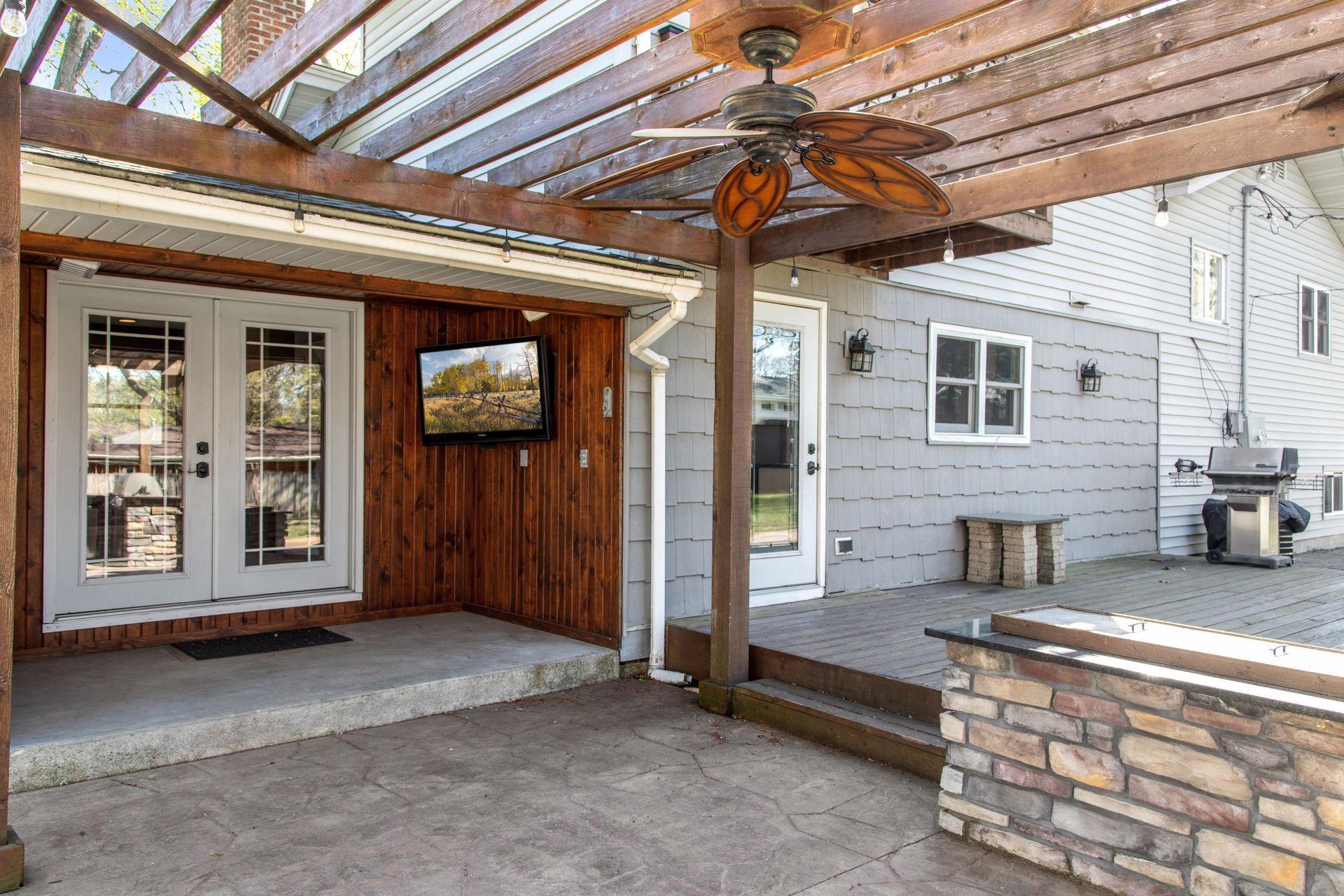 Plus a covered porch with TV and speakers for movie nights outside.