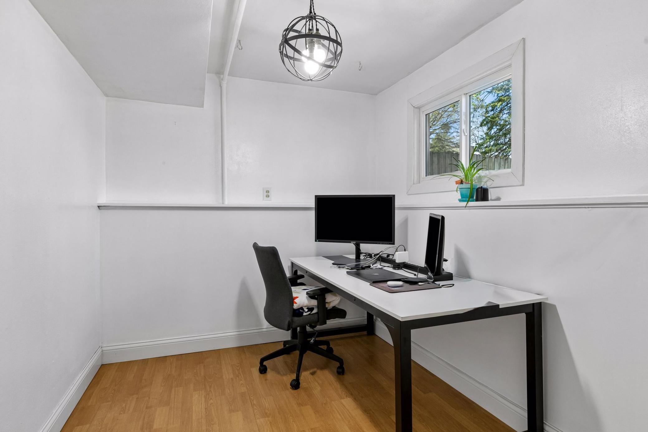 Bonus room off the laundry room! Perfect for a private office, fitness space, or studio.