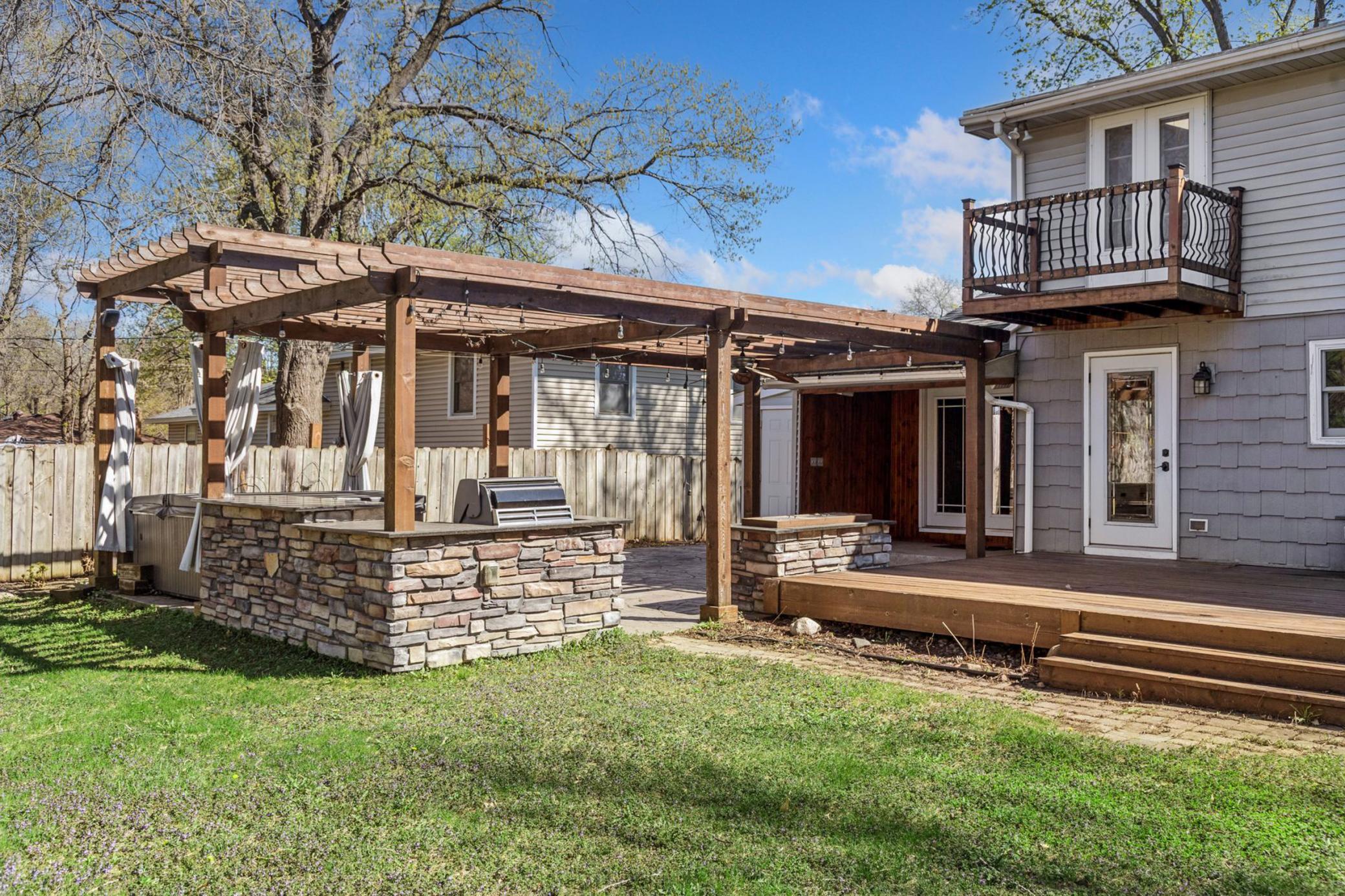 Owners suite balcony overlooks the backyard.