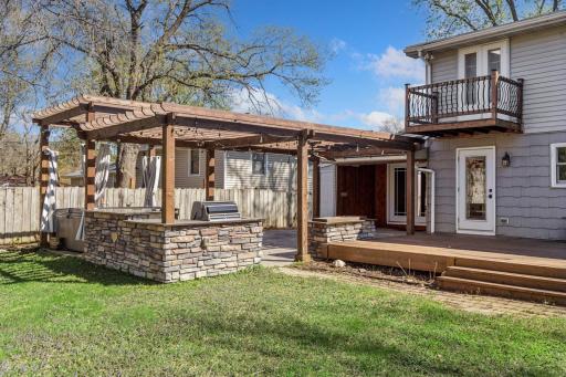 Owners suite balcony overlooks the backyard.