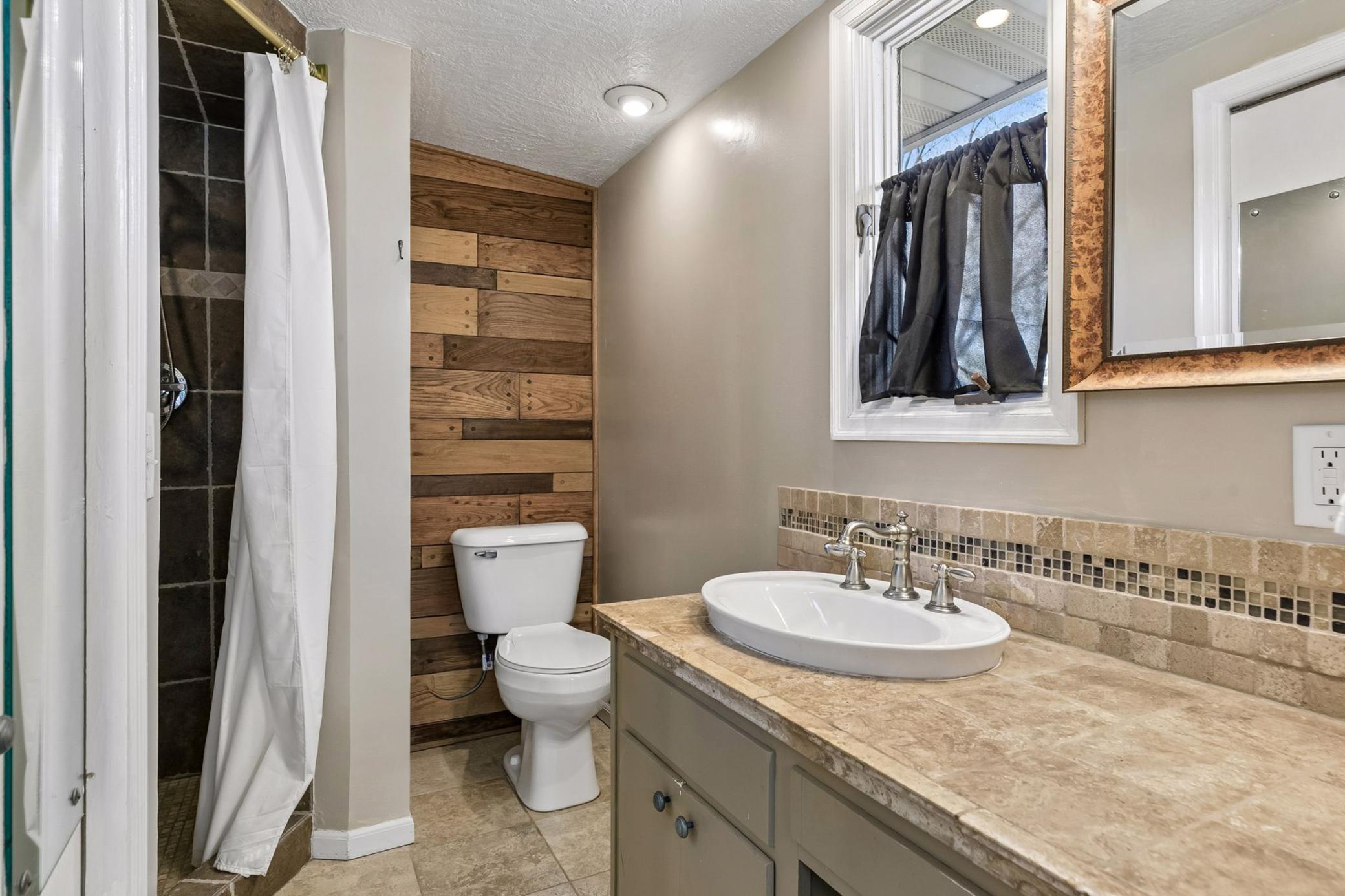 Private 3/4 bath with tiled walk-in shower.