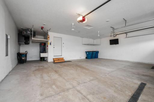 Oversized Heated and Insulated Garage With Overhead Storage And Work Bench