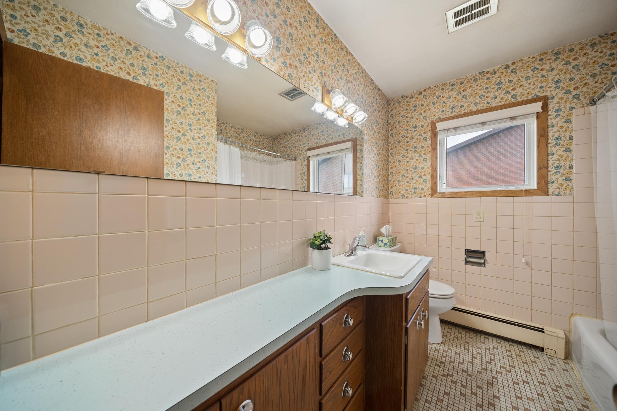 Full bath with tile floor