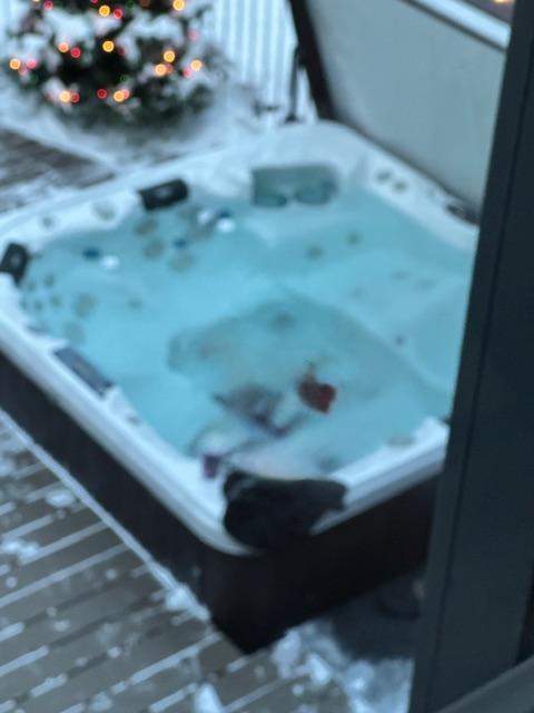 Relax and Unwind in the Private Hot tub, perfect for Year-Round Enjoyment
