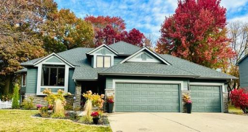 Front Photo Showcases the Home Framed by Vibrant Autumn Foliage in Fall