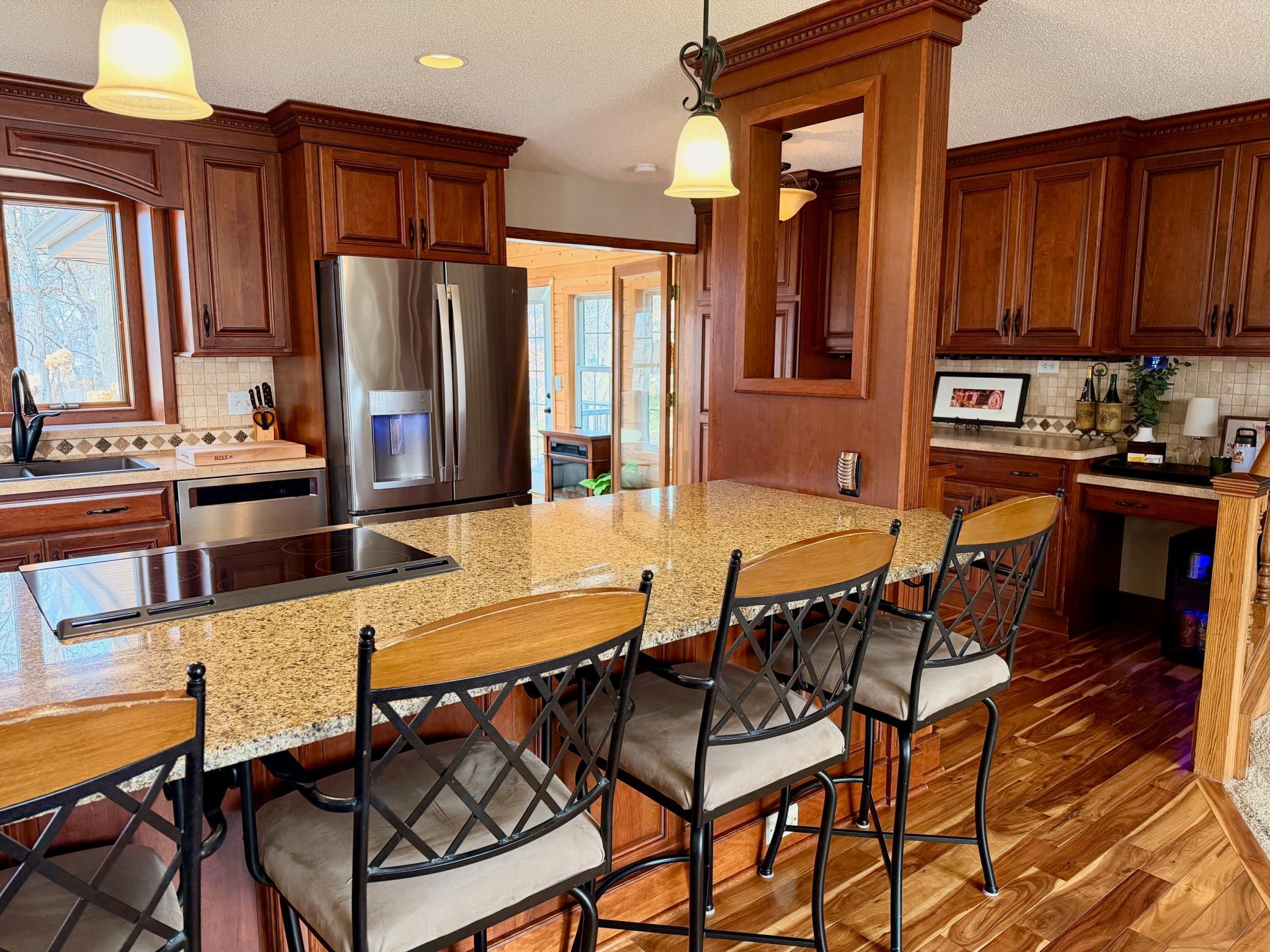 Open Concept with counter for dining or sitting while the chef cooks