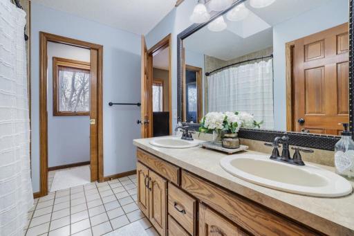Large Bathroom with Double Sinks and 2 Shower Areas