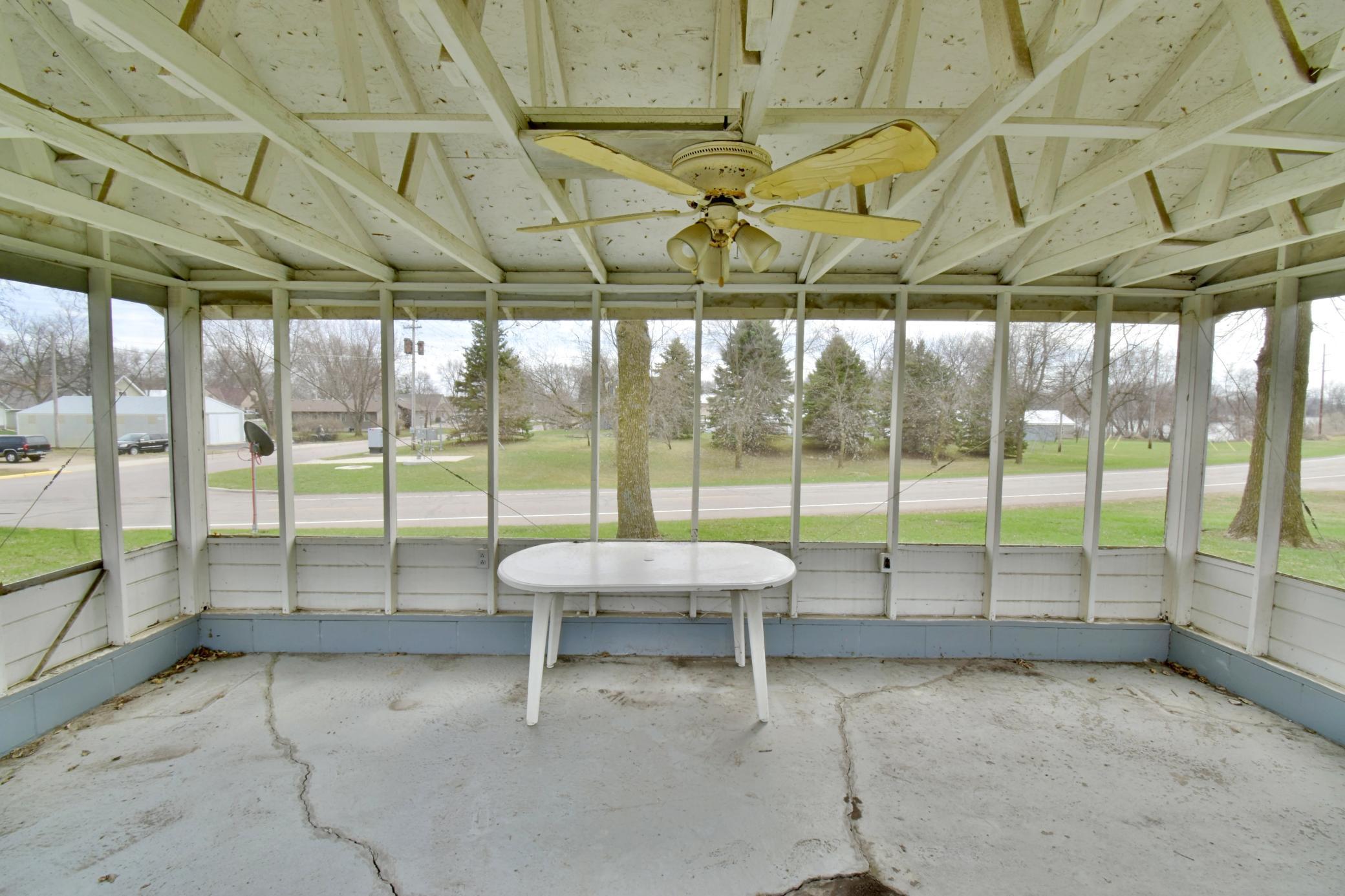 Interior of the screen porch - complete with ceiling fan to keep the air moving!