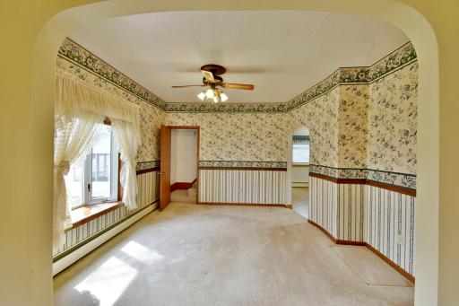 Dedicated dining area just off the kitchen features a large bay window