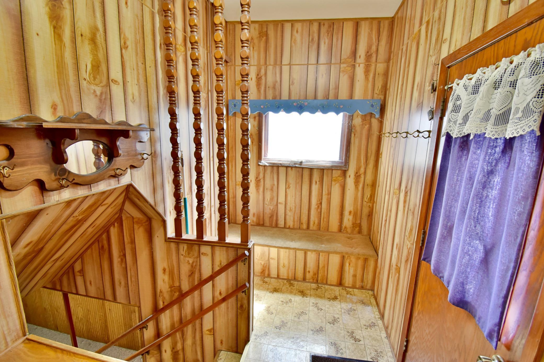 Large mudroom area just inside the back entrance