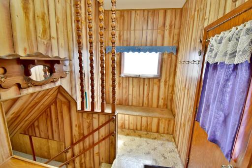 Large mudroom area just inside the back entrance