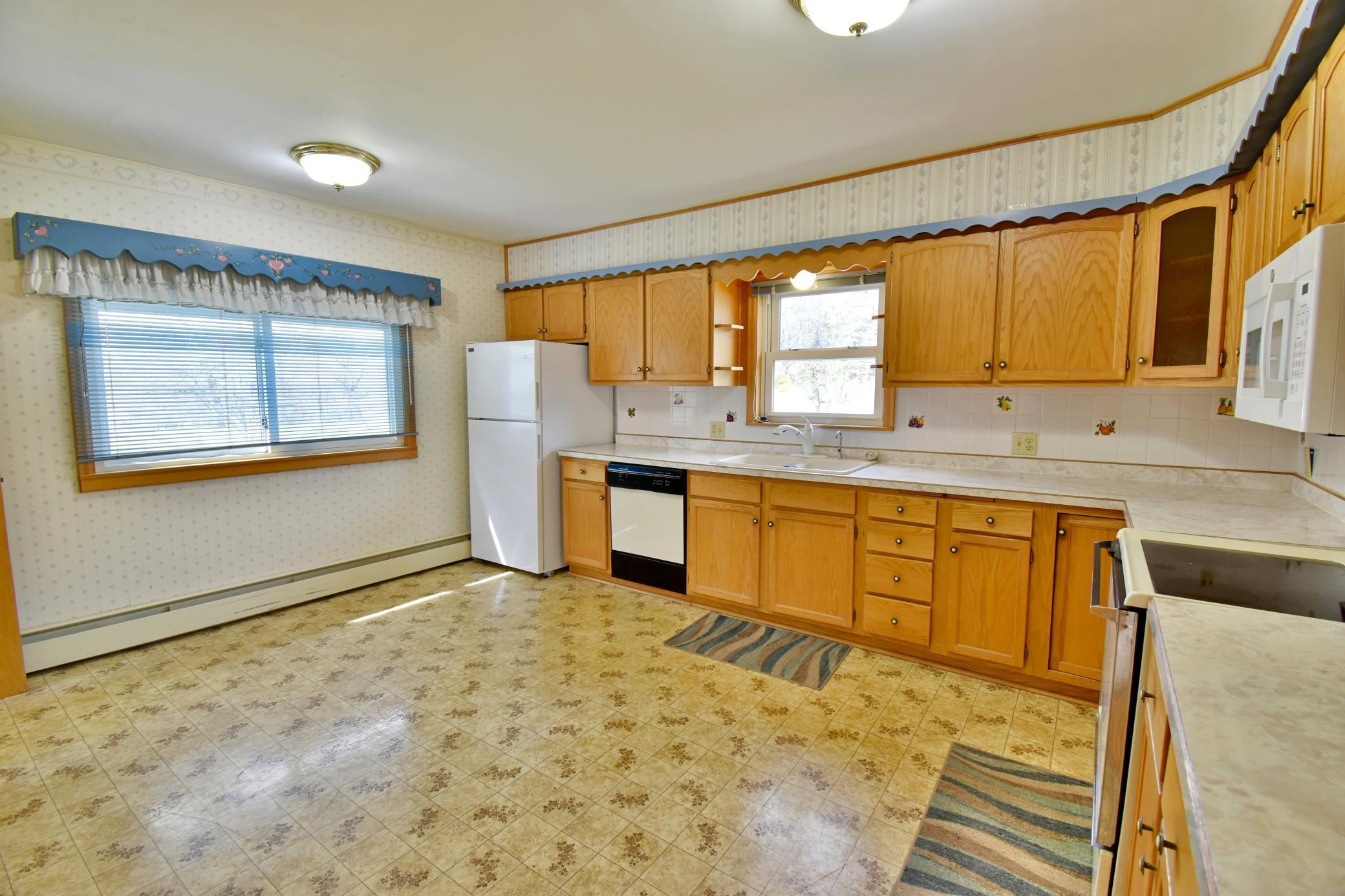 Kitchen is large enough that you could put an additional table under the window!