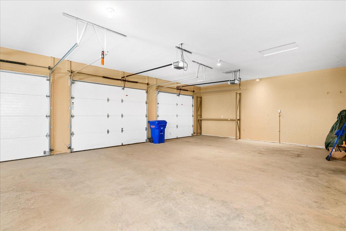 Attached 3 car garage with back yard access