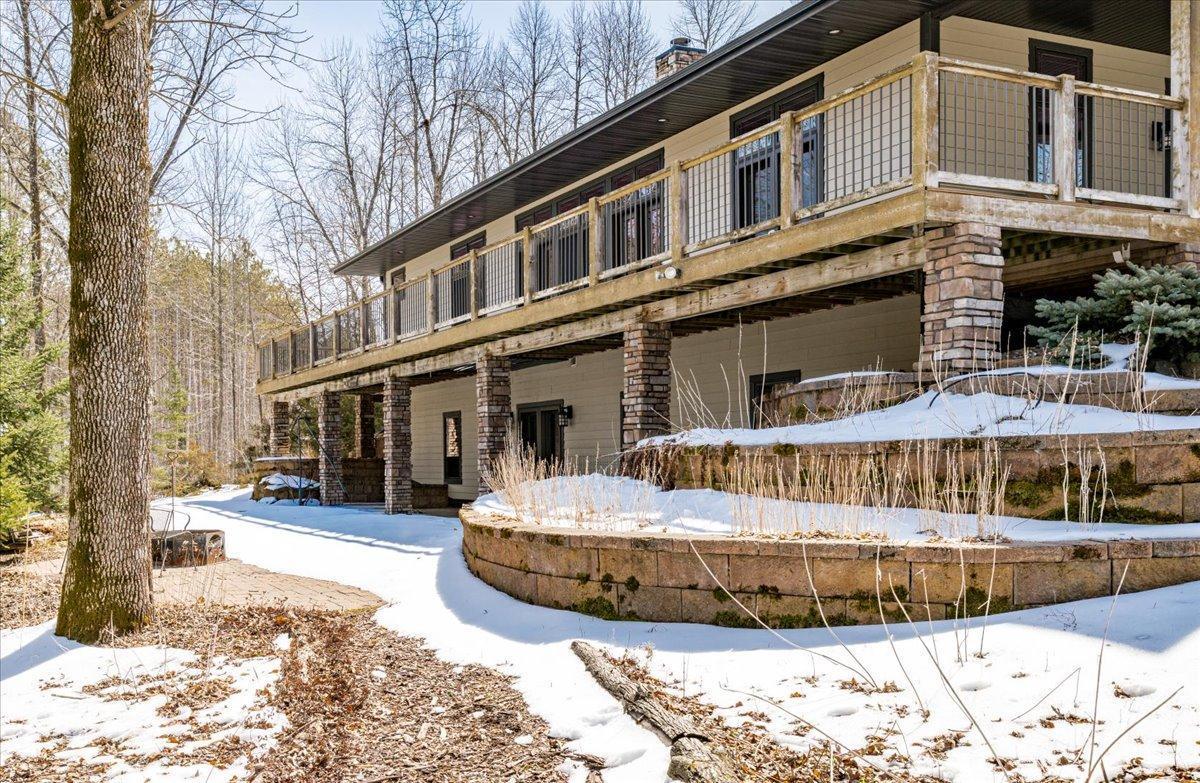 Upper and lower levels have French door access to deck and patio