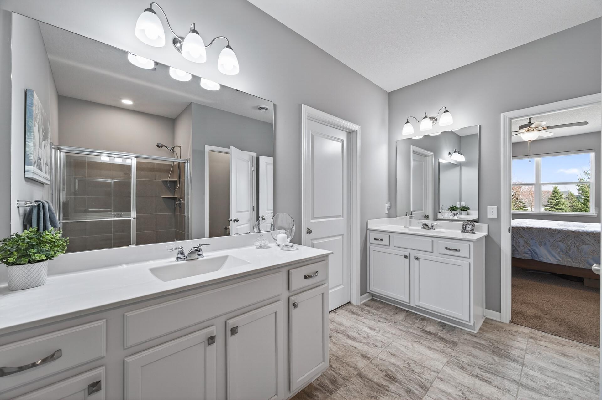 Serene retreat to wake up to, with separate vanities for effortless mornings.
