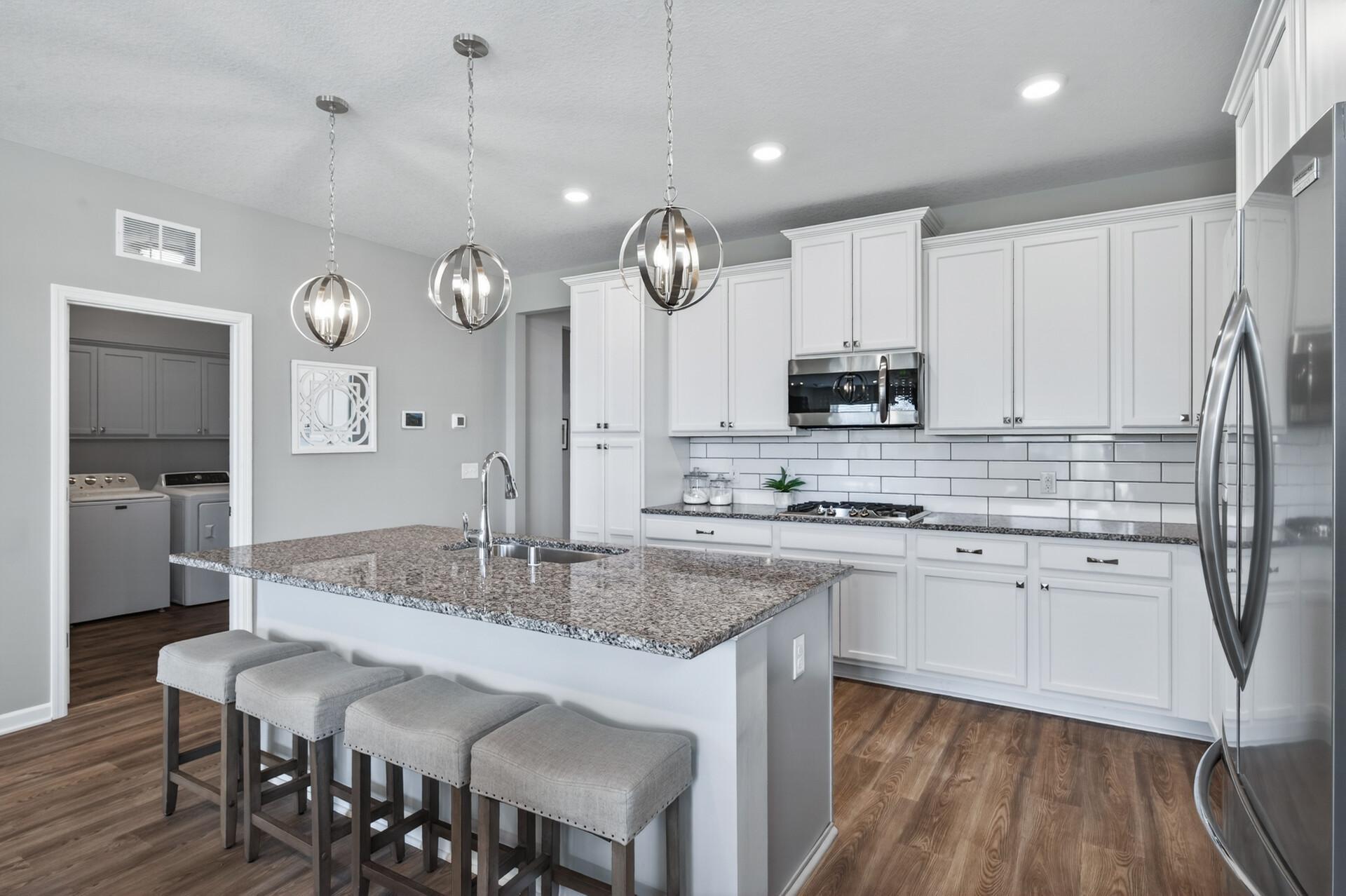 Huge breakfast bar, perfect for casual dining and offering ample counter space for baking cookies or preparing pizzas!