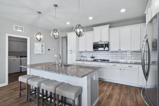 Huge breakfast bar, perfect for casual dining and offering ample counter space for baking cookies or preparing pizzas!