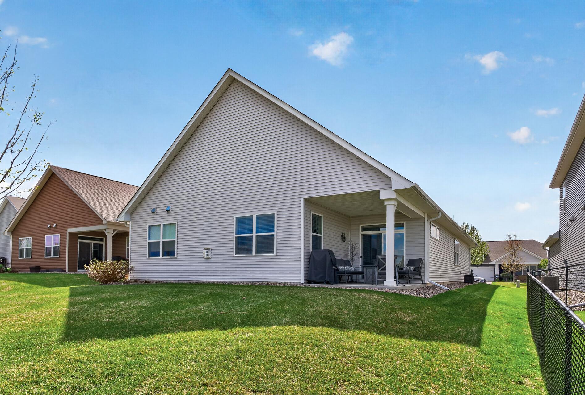 Walk straight out for yard games! This home makes living easy! Lawn care is covered by the HOA! Enjoy shade at the end of the day.