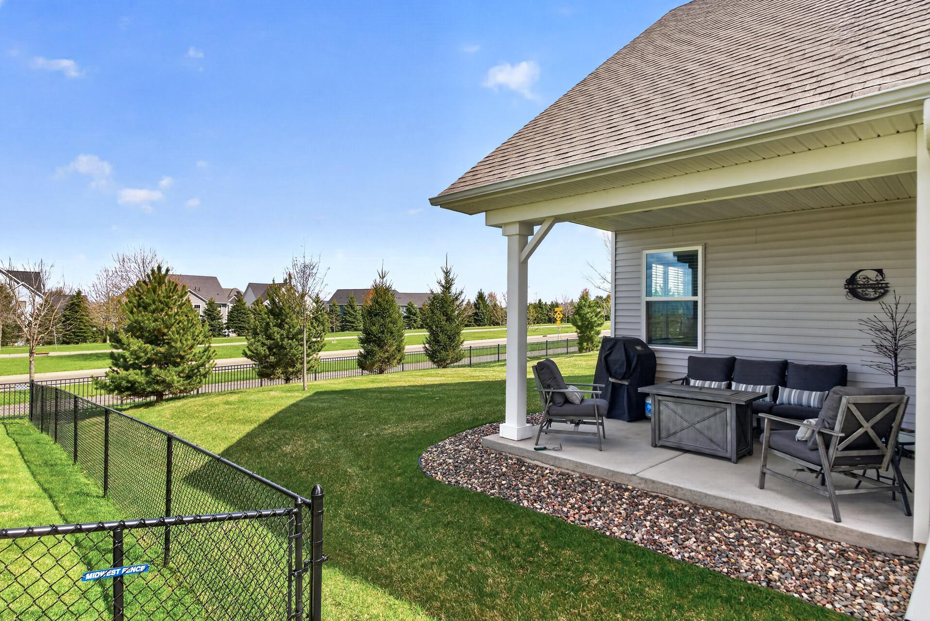 Offers both a front porch and a covered back porch.