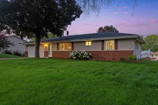 Charming curb appeal with fresh landscaping, new roof (2025), and a spacious 2-car attached garage.