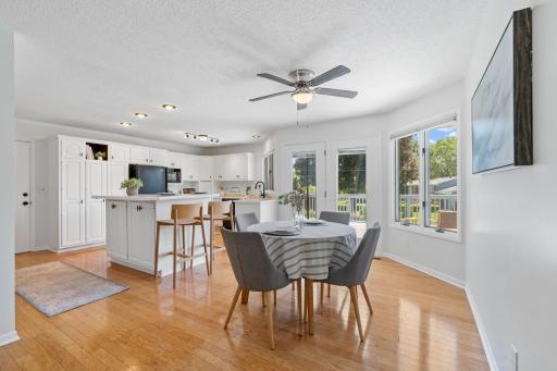 Spacious dining area with hardwood floors and access to the large updated deck â perfect for entertaining.