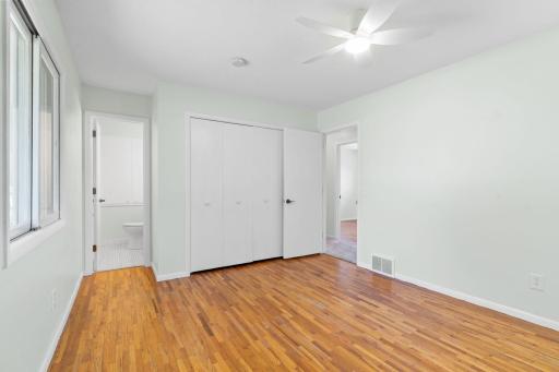Spacious Primary bedroom with bathroom and large closet space.
