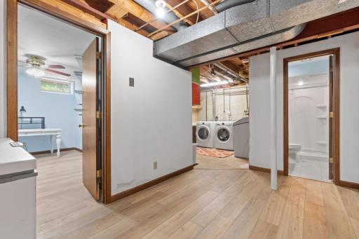 Walkway to laundry room, den and full bathroom