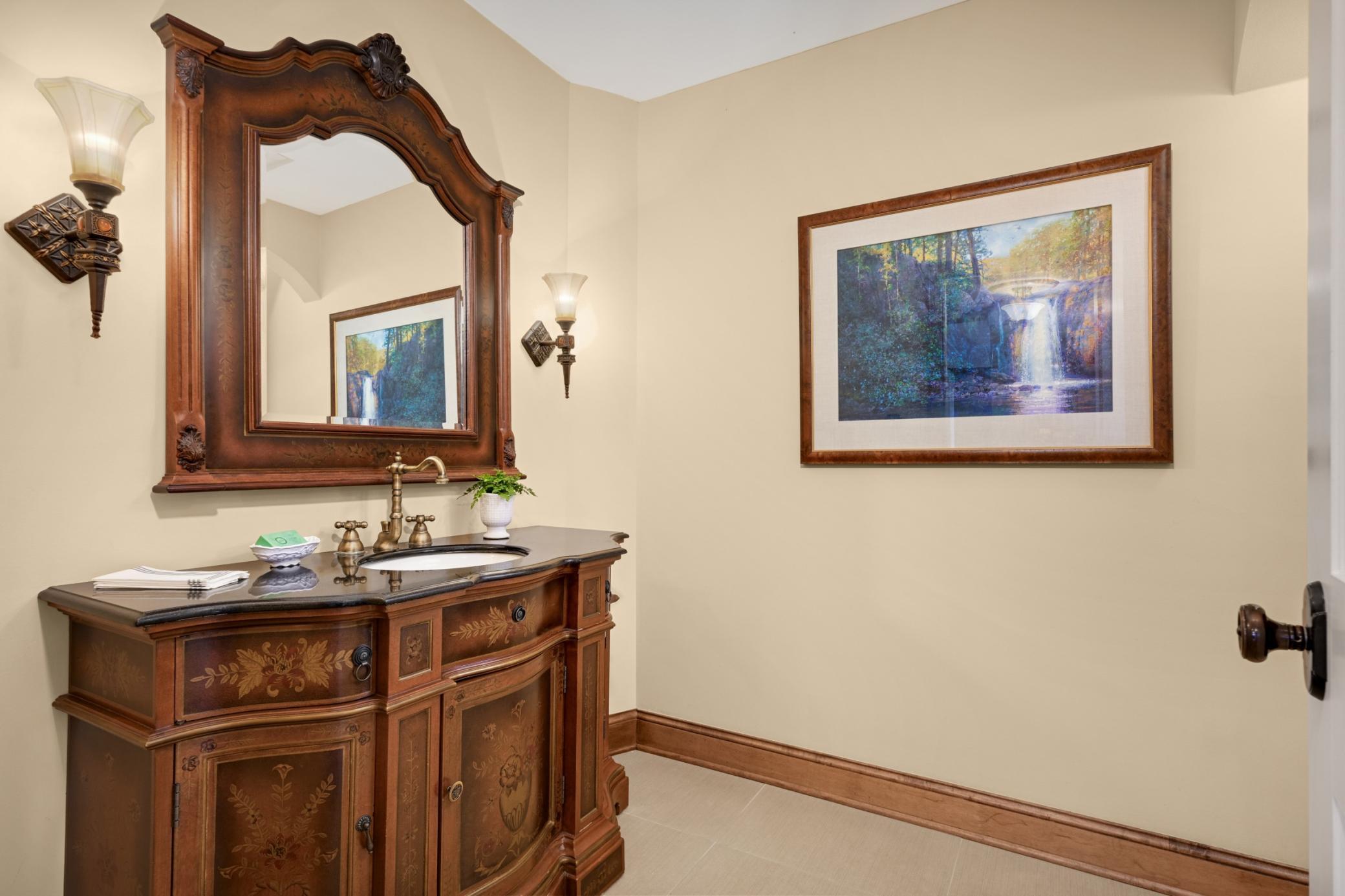 There is a nice size guest bath off the foyer with a secluded shower.