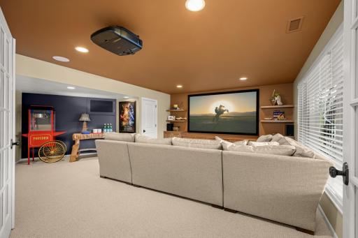 The redesigned theater room has a wall of new built-in for storage and the TV plus a closet if needed for a fifth bedroom.