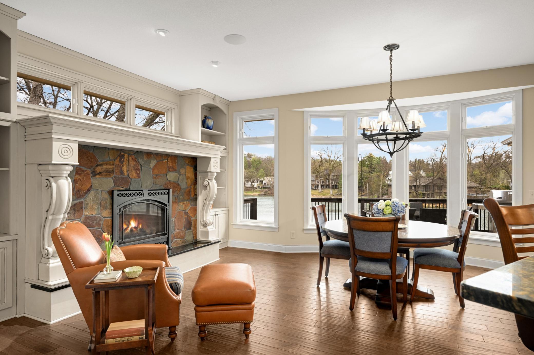 A large bow window overlooks the lake and a patio door leads out to the deck, spiral staircase and room to BBQ and entertain.