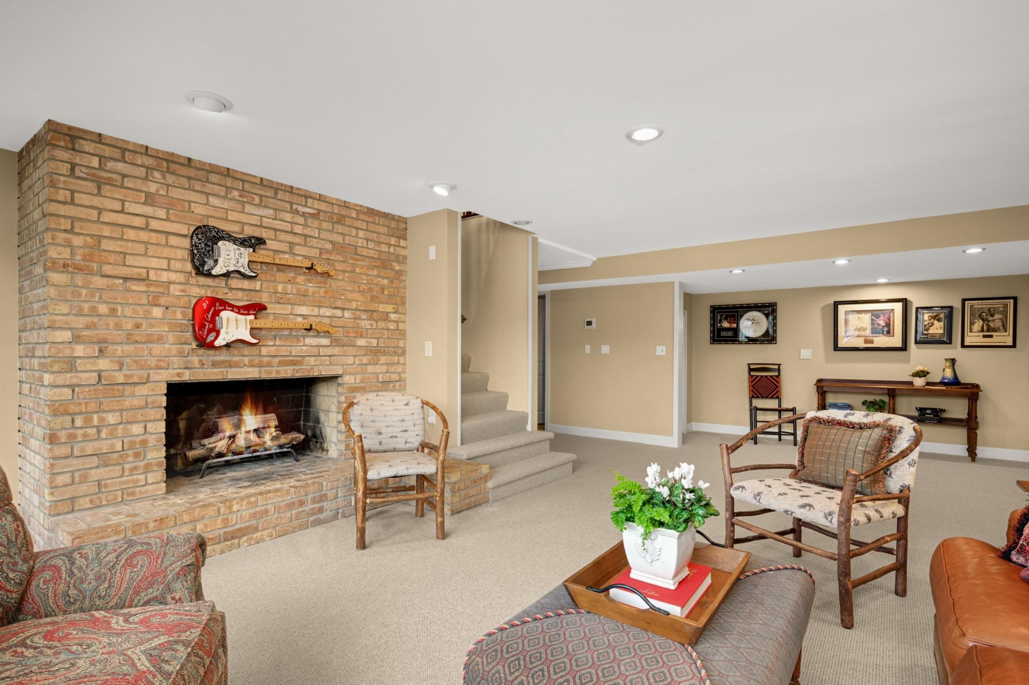 A large brick, wood-burning fireplace