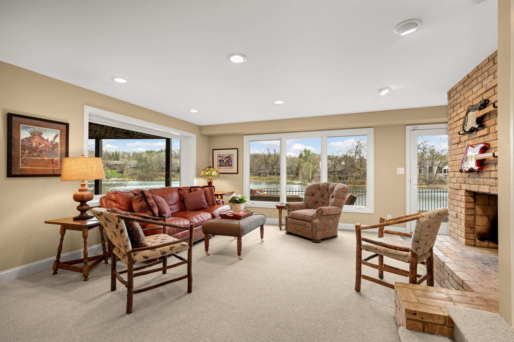 The walkout level offers an additional family room with two vast windows overlooking the lake