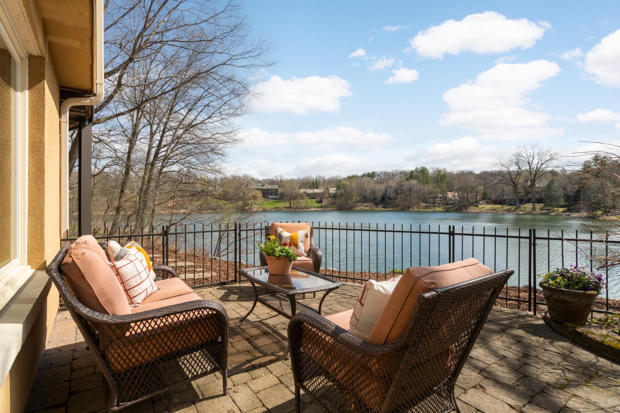 A fenced paver patio