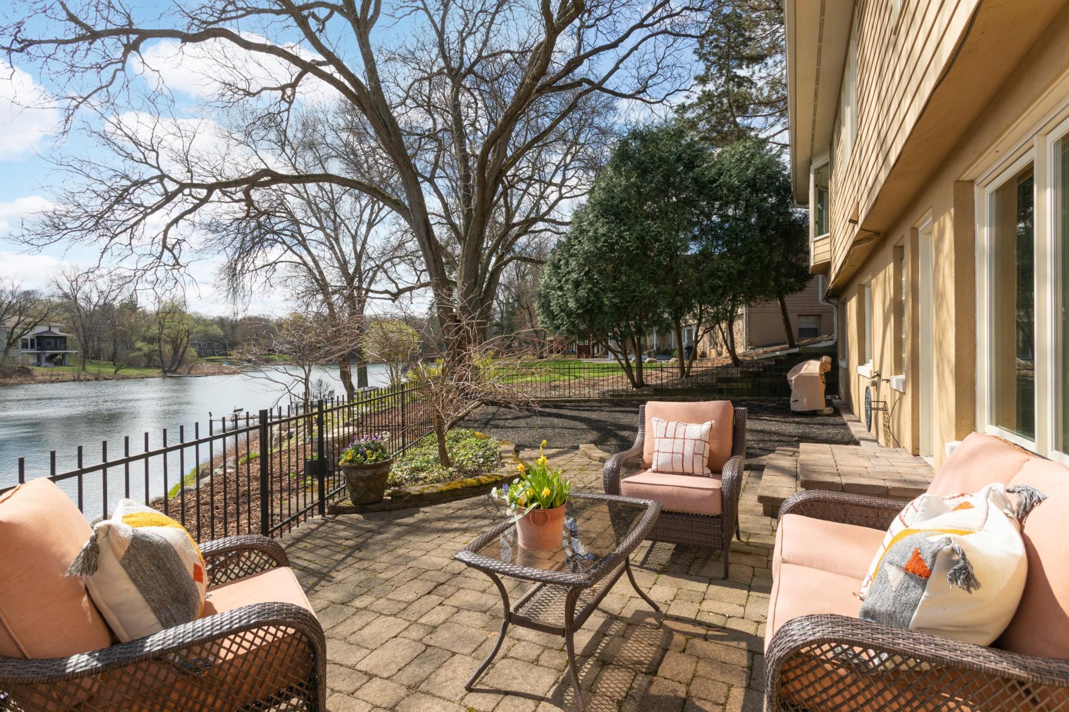 A play area with a rubber base and rubber mulch for kids to play.