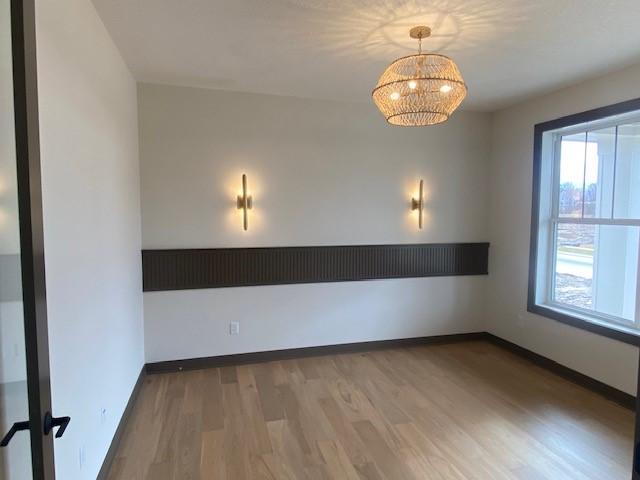 Spacious front office with 8'H double glass doors and gorgeous oak hardwood flooring