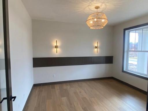 Spacious front office with 8'H double glass doors and gorgeous oak hardwood flooring